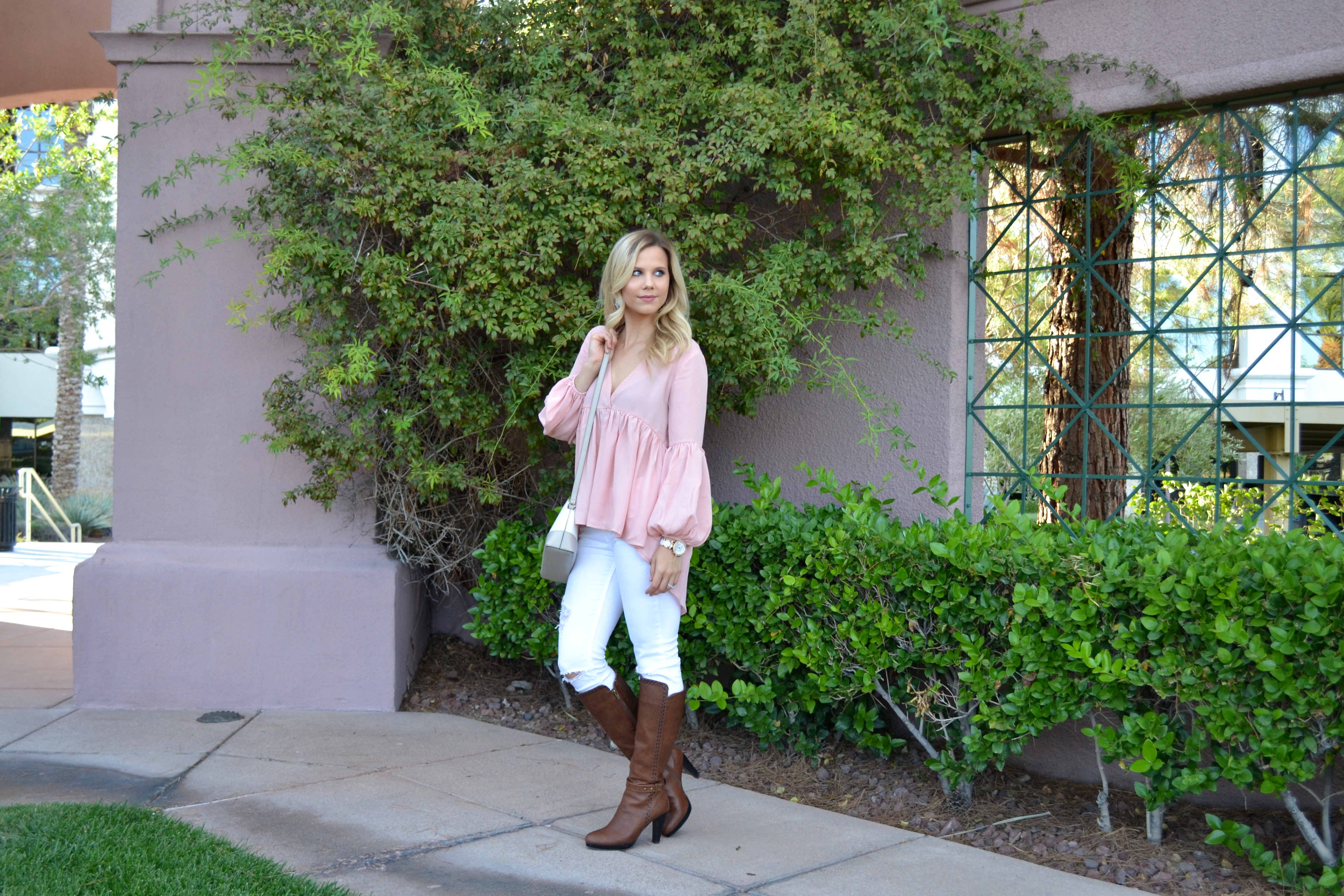 Pink High Low Blouse with White Jeans and Boots on Glam Life Living 