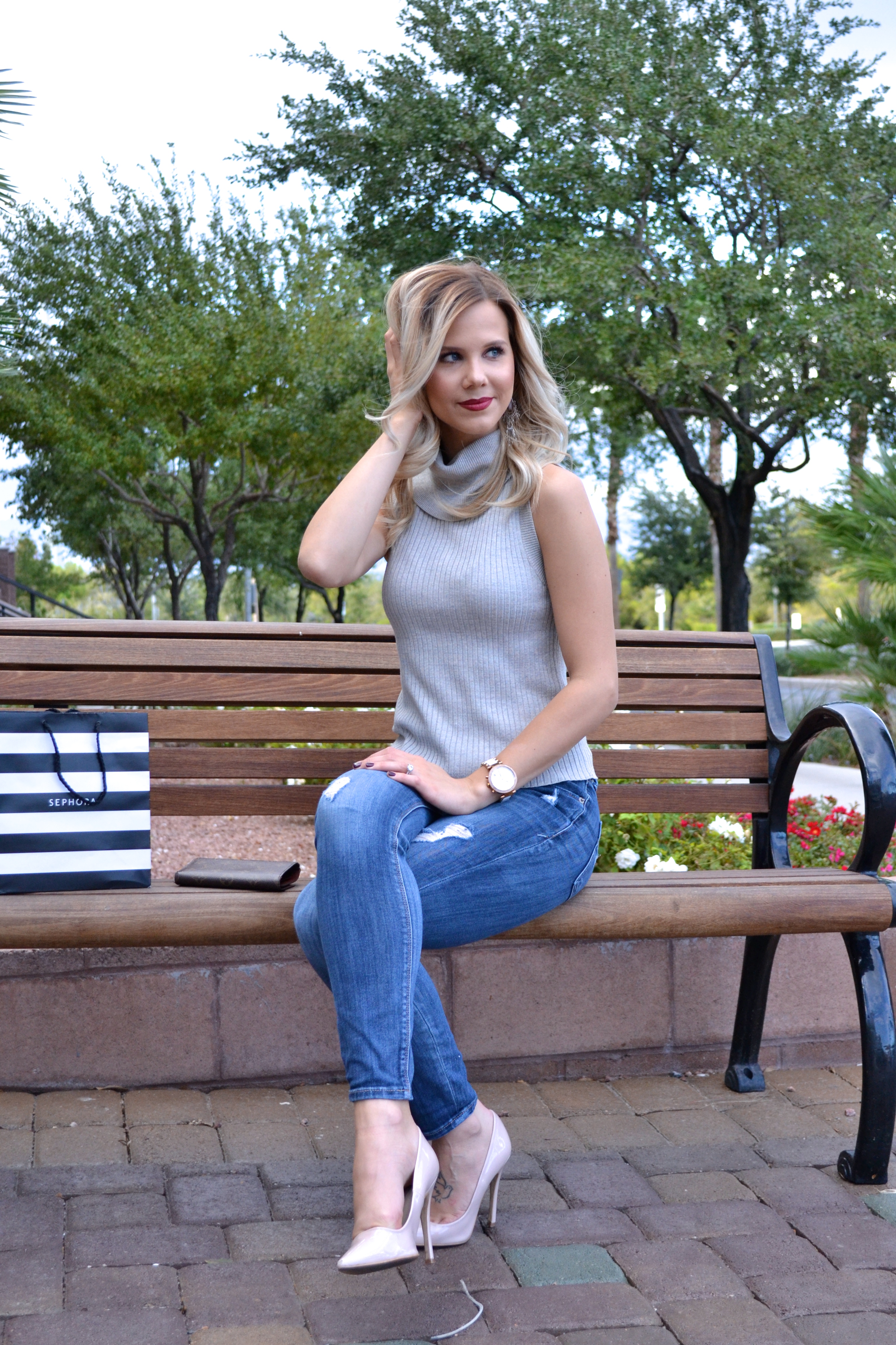 sleeveless sweater in ripped jeans |5 Ways to Treat Yourself Today|