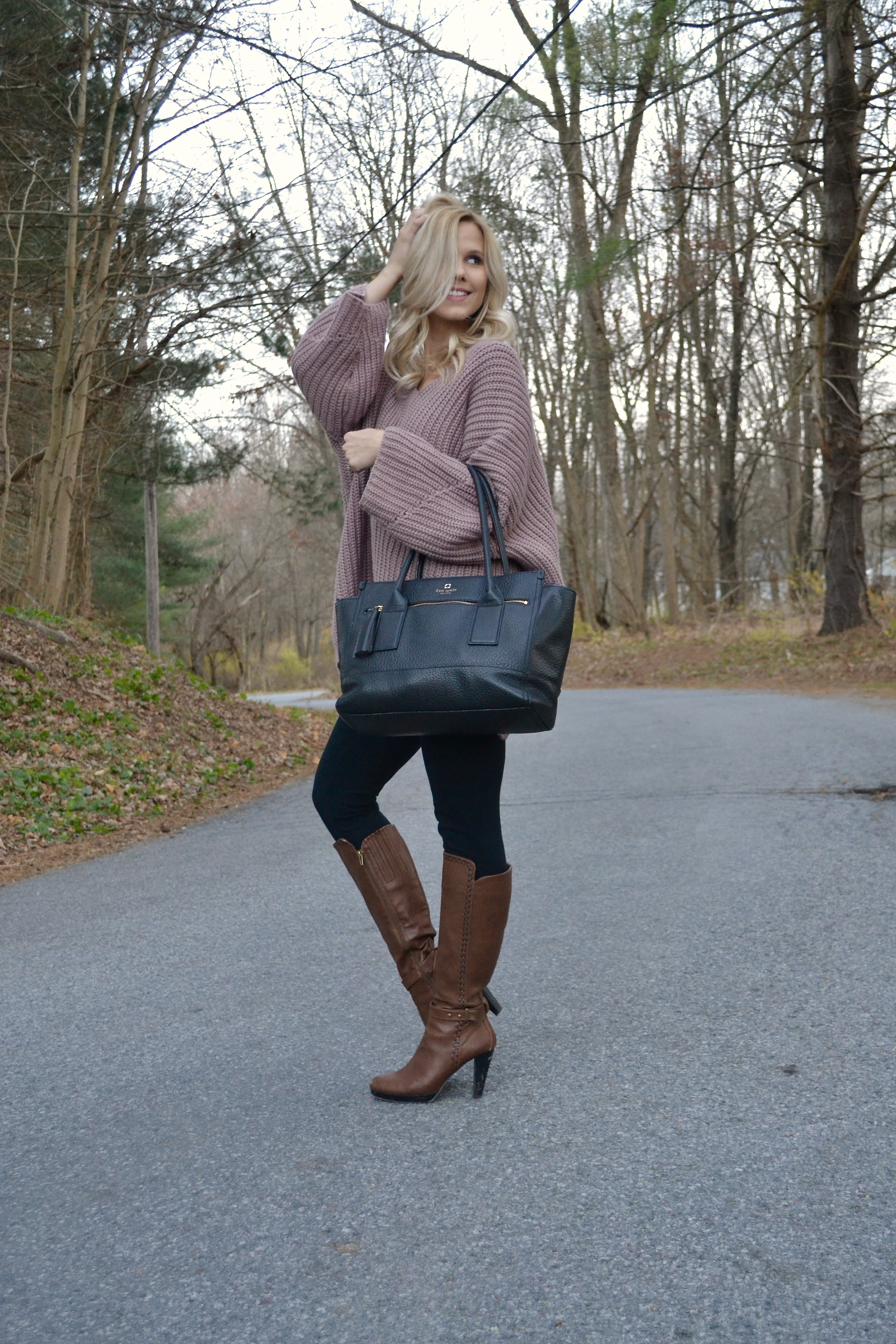 Pink Oversized Sweater with Brown Heeled Booties and Black Kate Spade Purse 