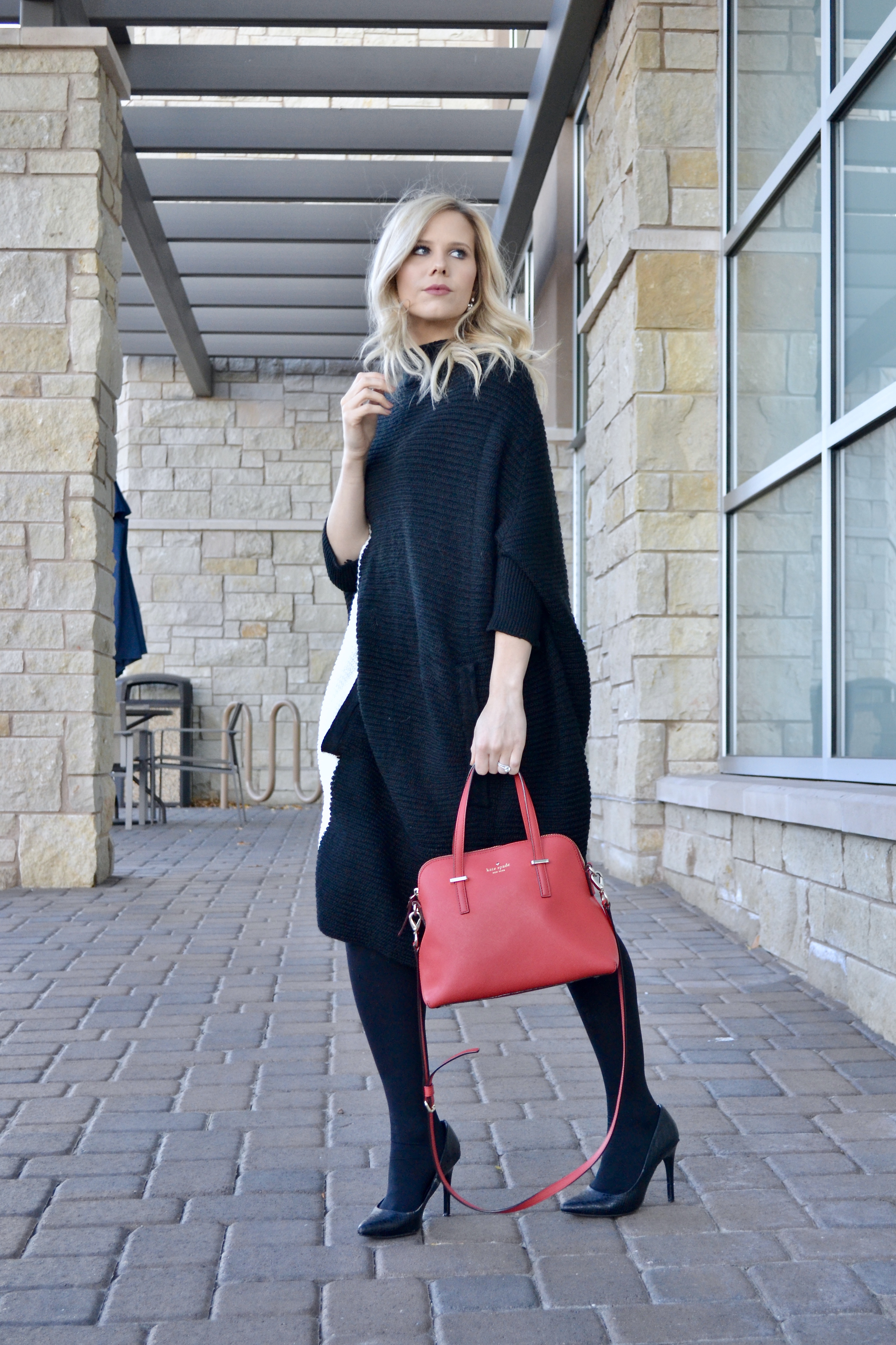 black and white color black sweater with Kate Spade red bag