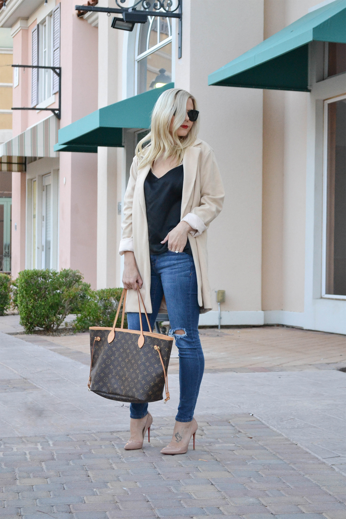 fashion blogger in tan overcoat