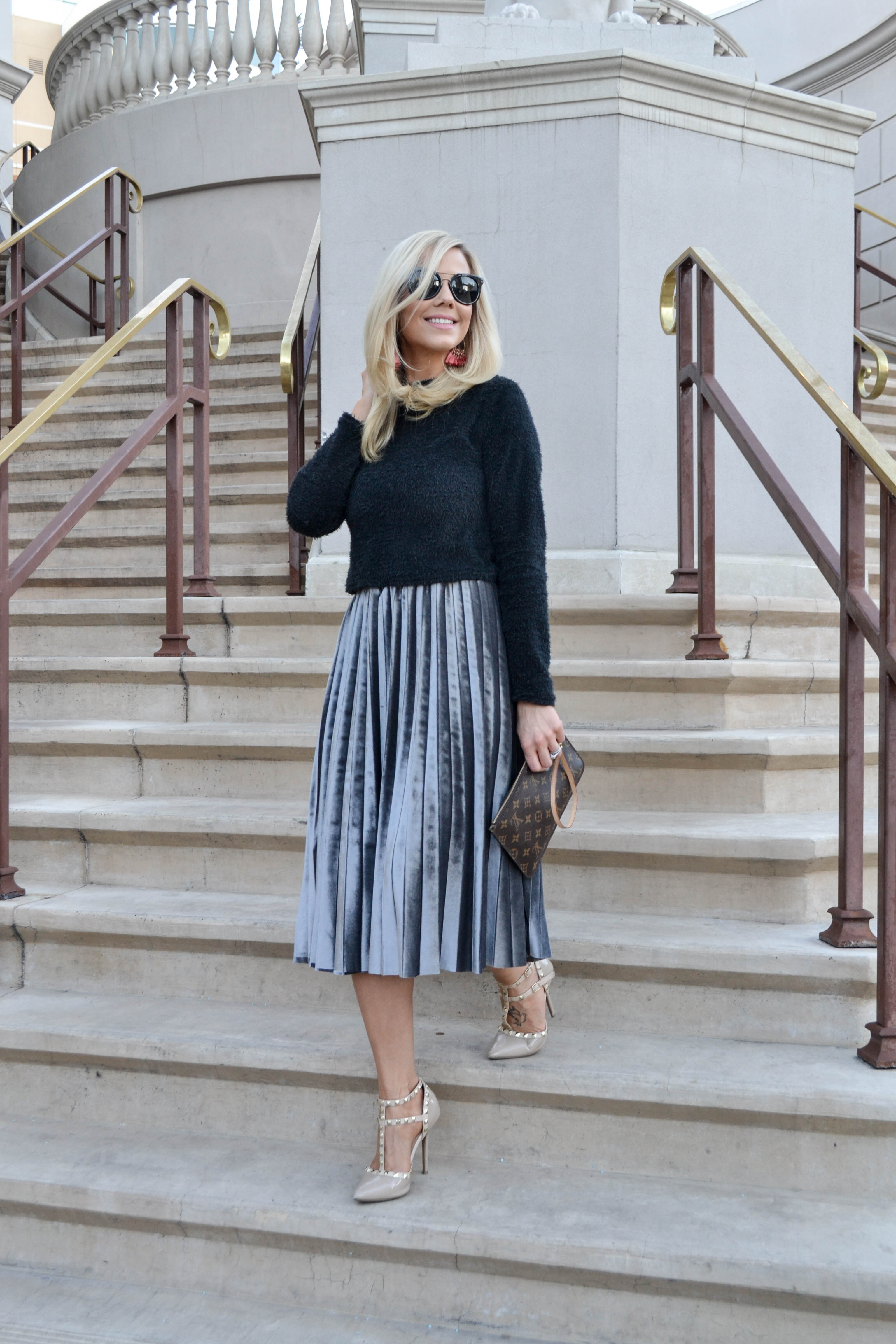 fashion blogger in metallic skirt and black cropped sweater, perfect date night look, new years eve look