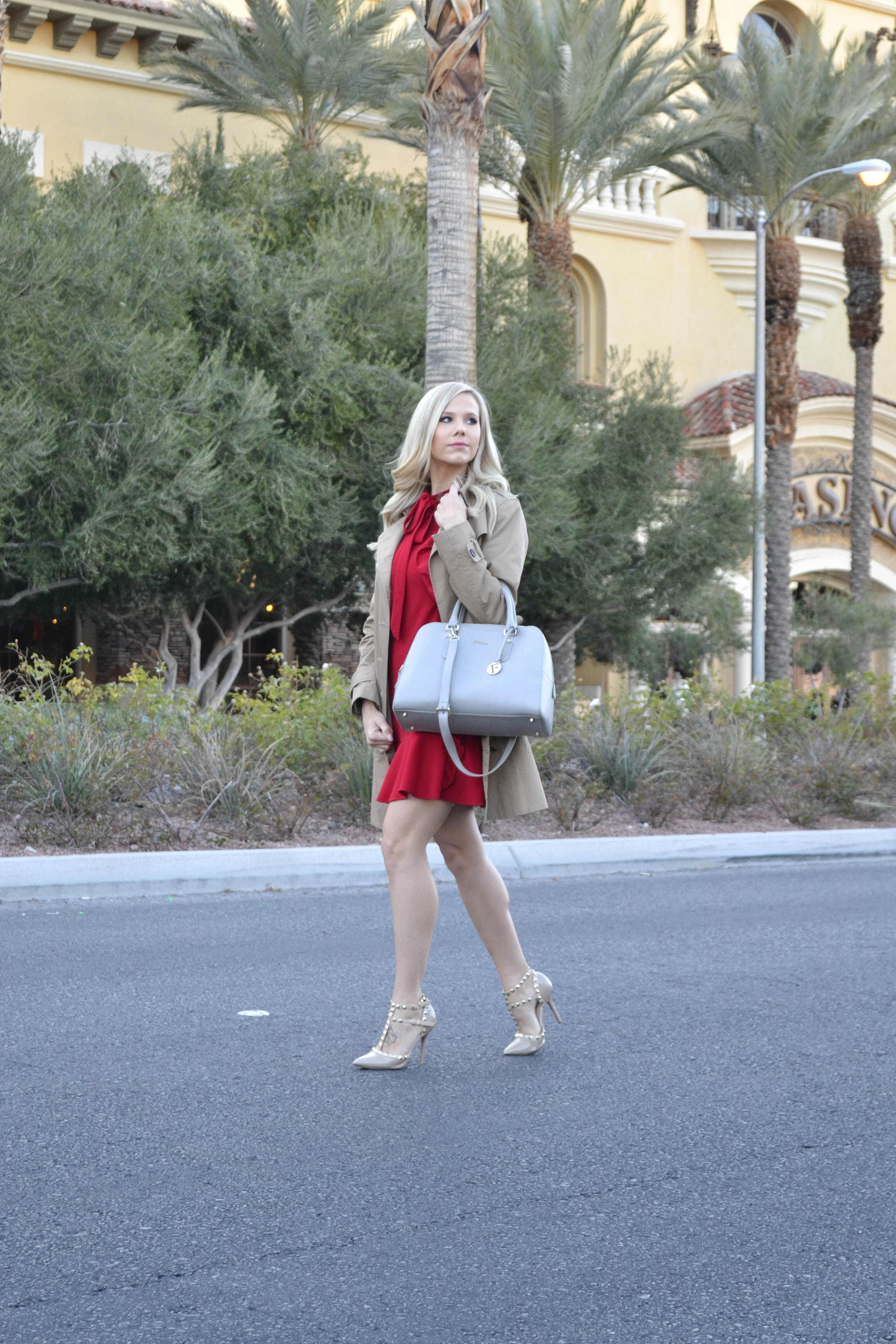 red ruffle dress and trench coat with grey furla bag