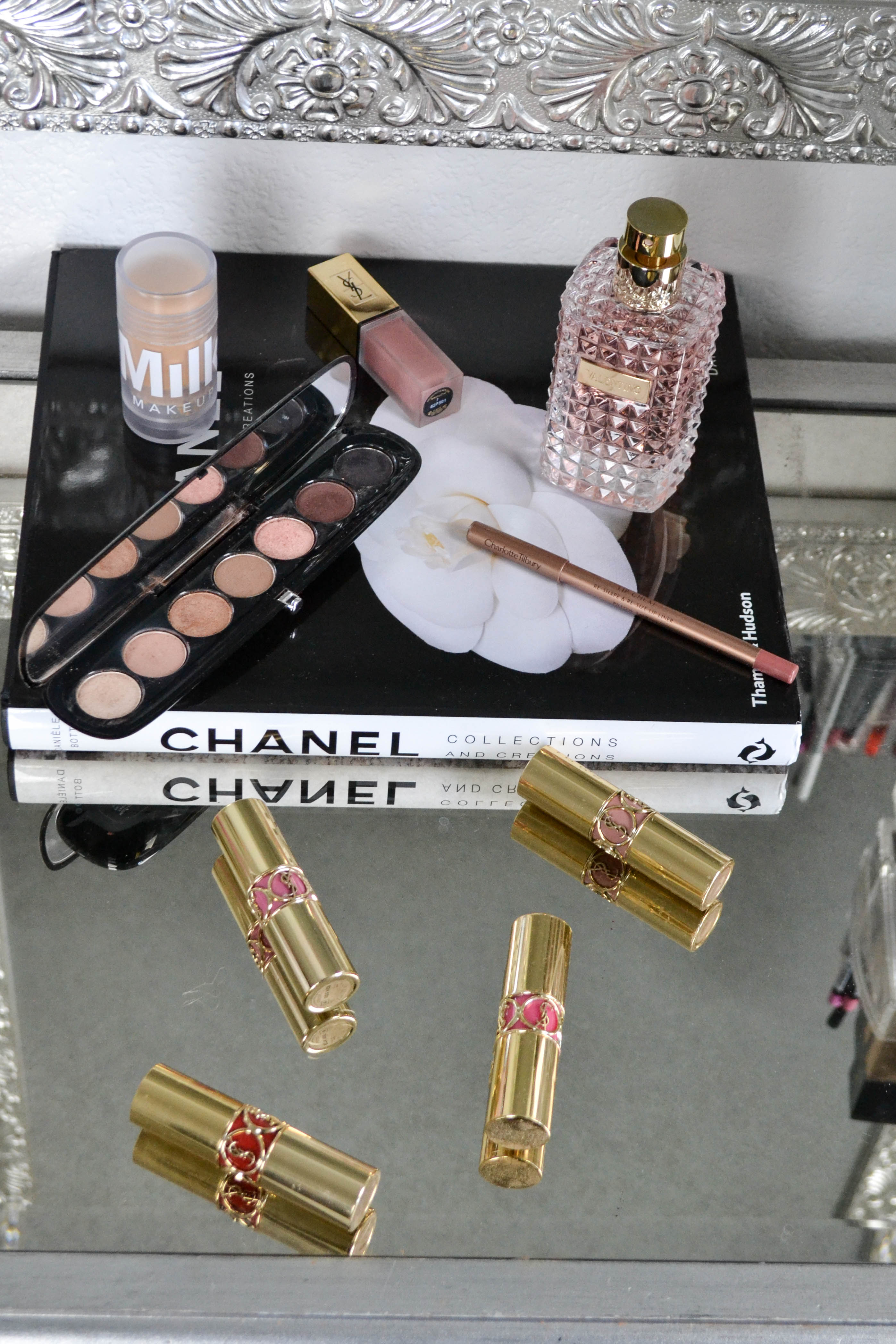 beauty products, valentino aqua purfume, marc jacobs eye shadow palette, ysl lipsticks