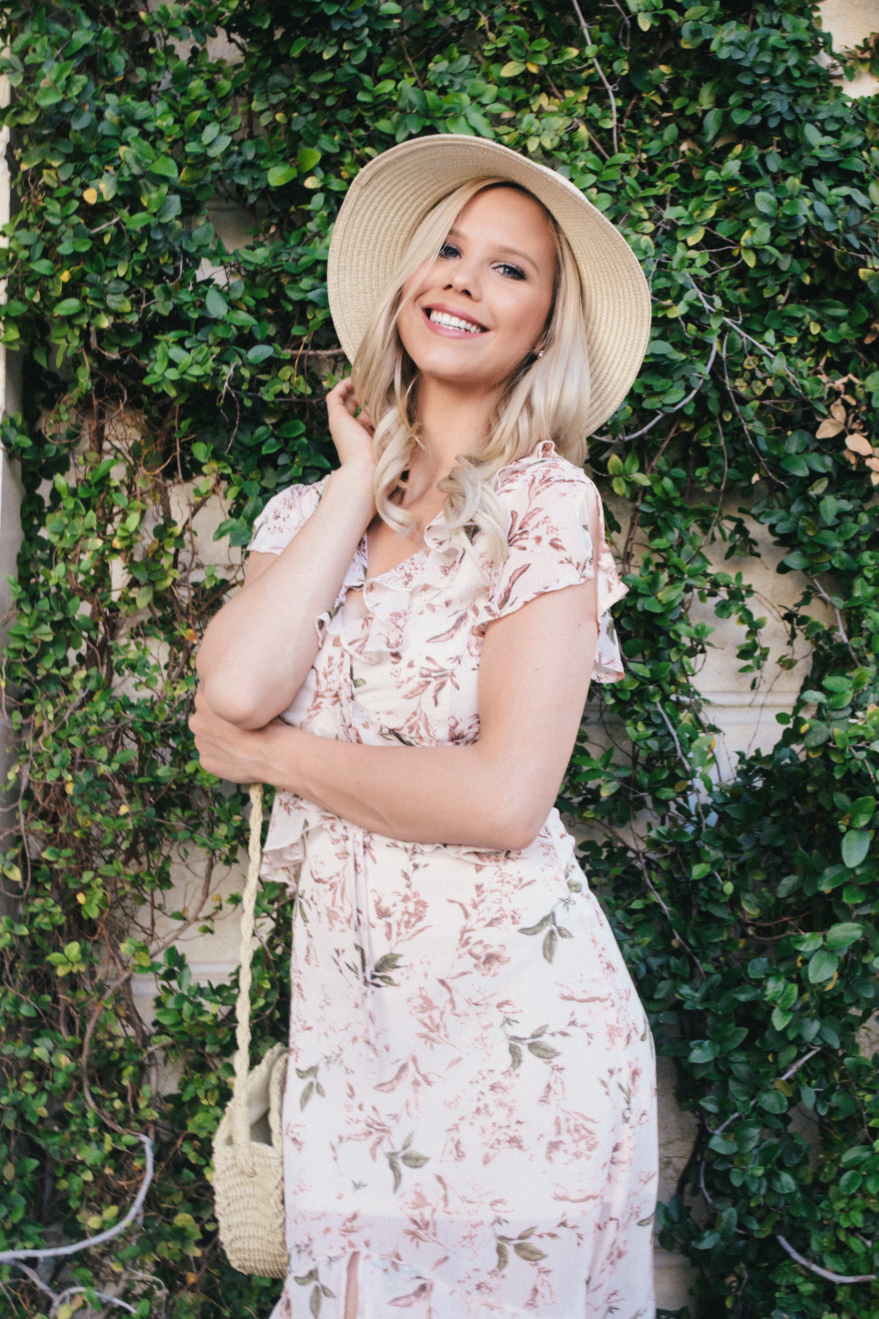 retro summer look with vintage floral dress and hat