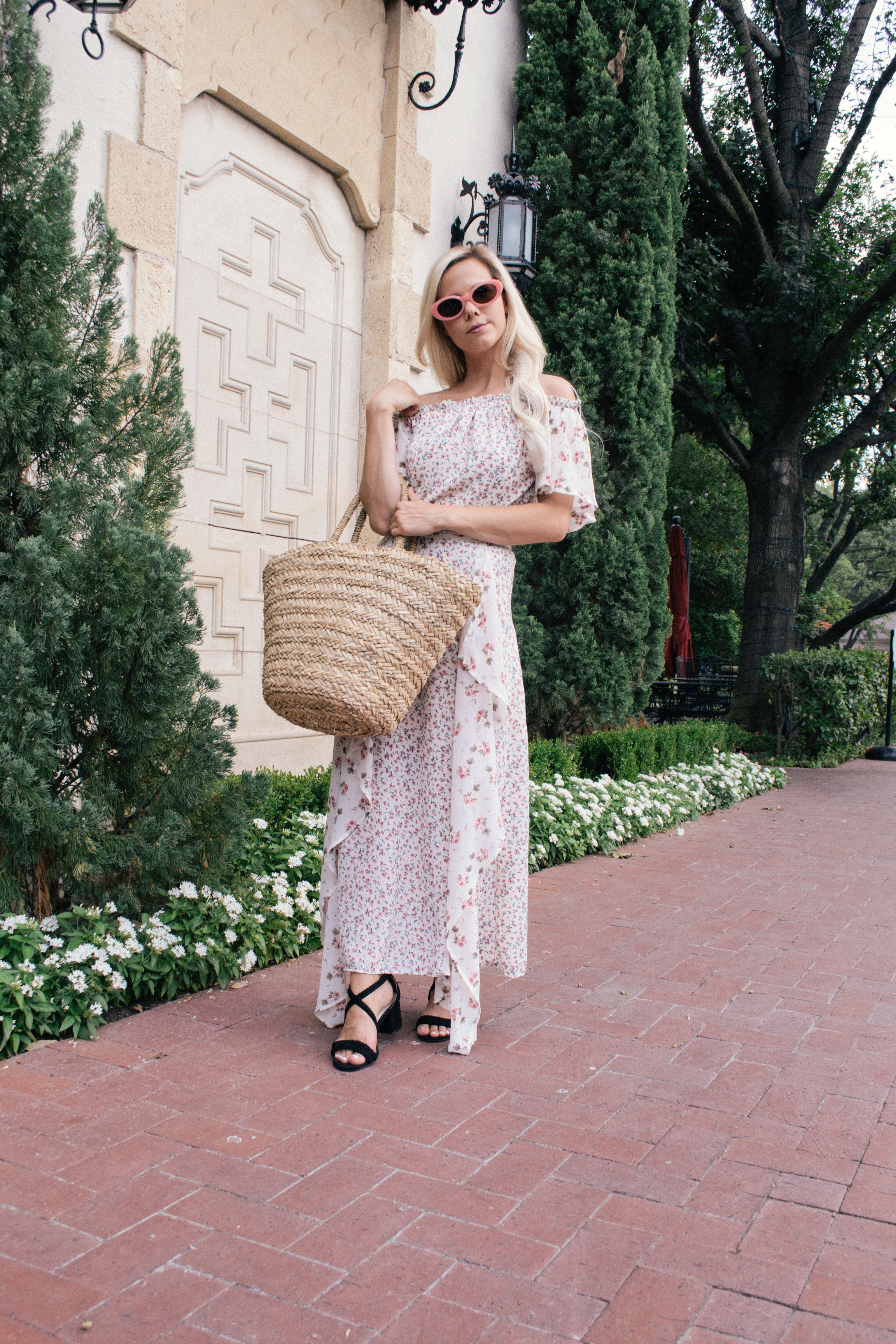 floral contrast off the shoulder maxi dress, basket bag, and pink sunglasses