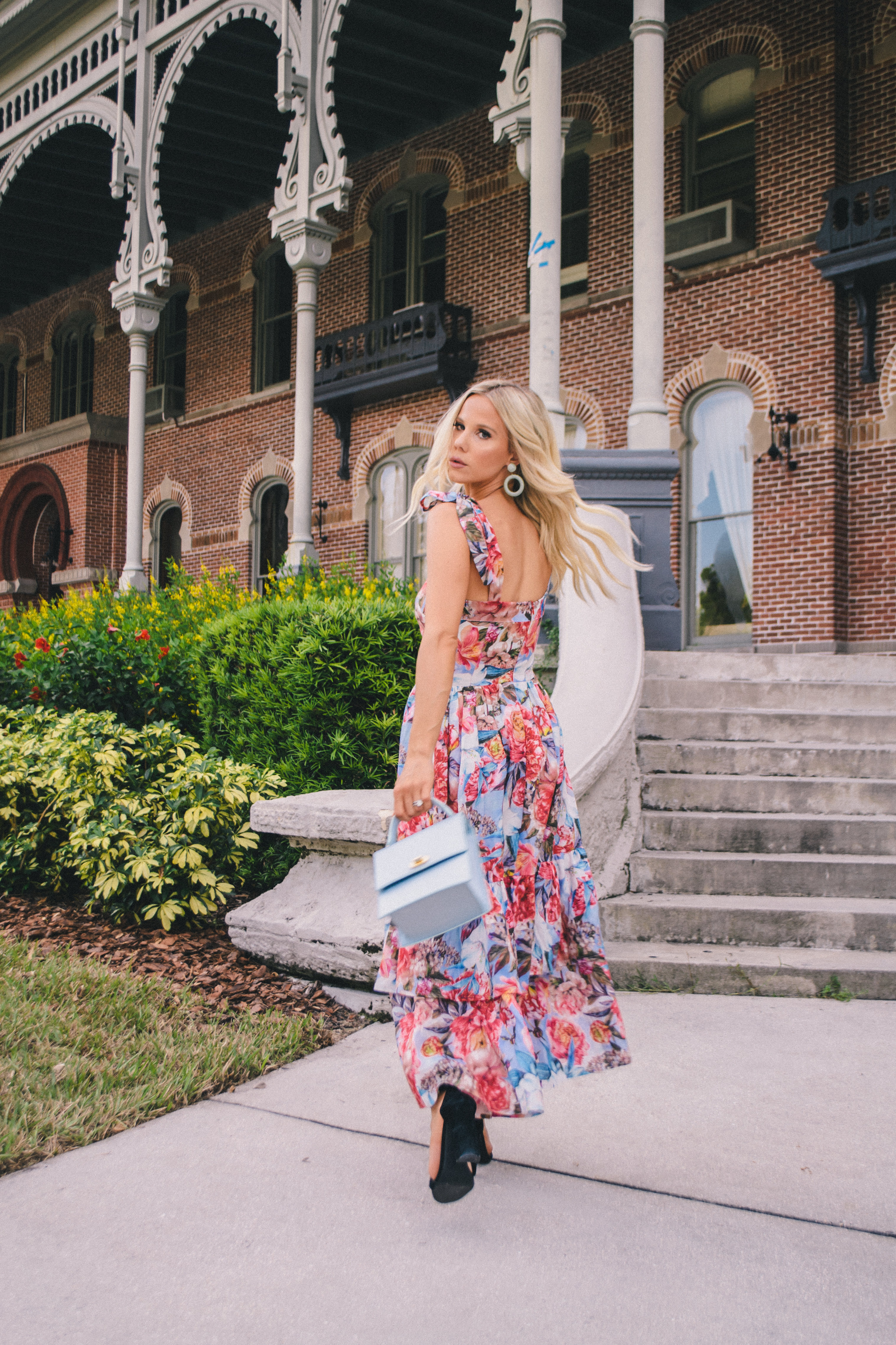 tropical destination vacation style in a floral ruffle hem midi dress by Hannah McDonnell of Glam Life Living #vacationstyle #tropicalstyle #vacationoutfit