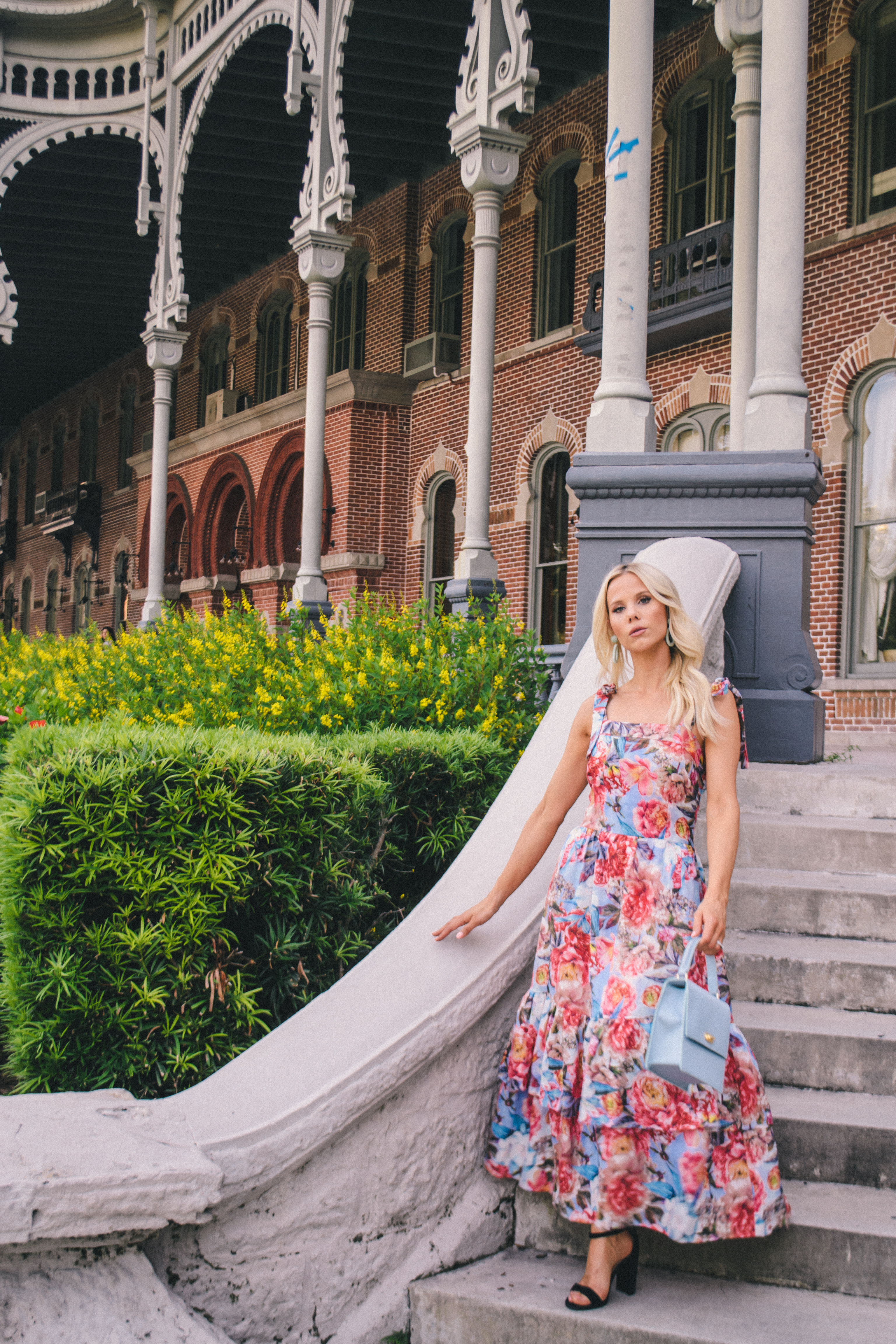 tropical destination vacation style in a floral ruffle hem midi dress by Hannah McDonnell of Glam Life Living #vacationstyle #tropicalstyle #vacationoutfit #floridaoutfit