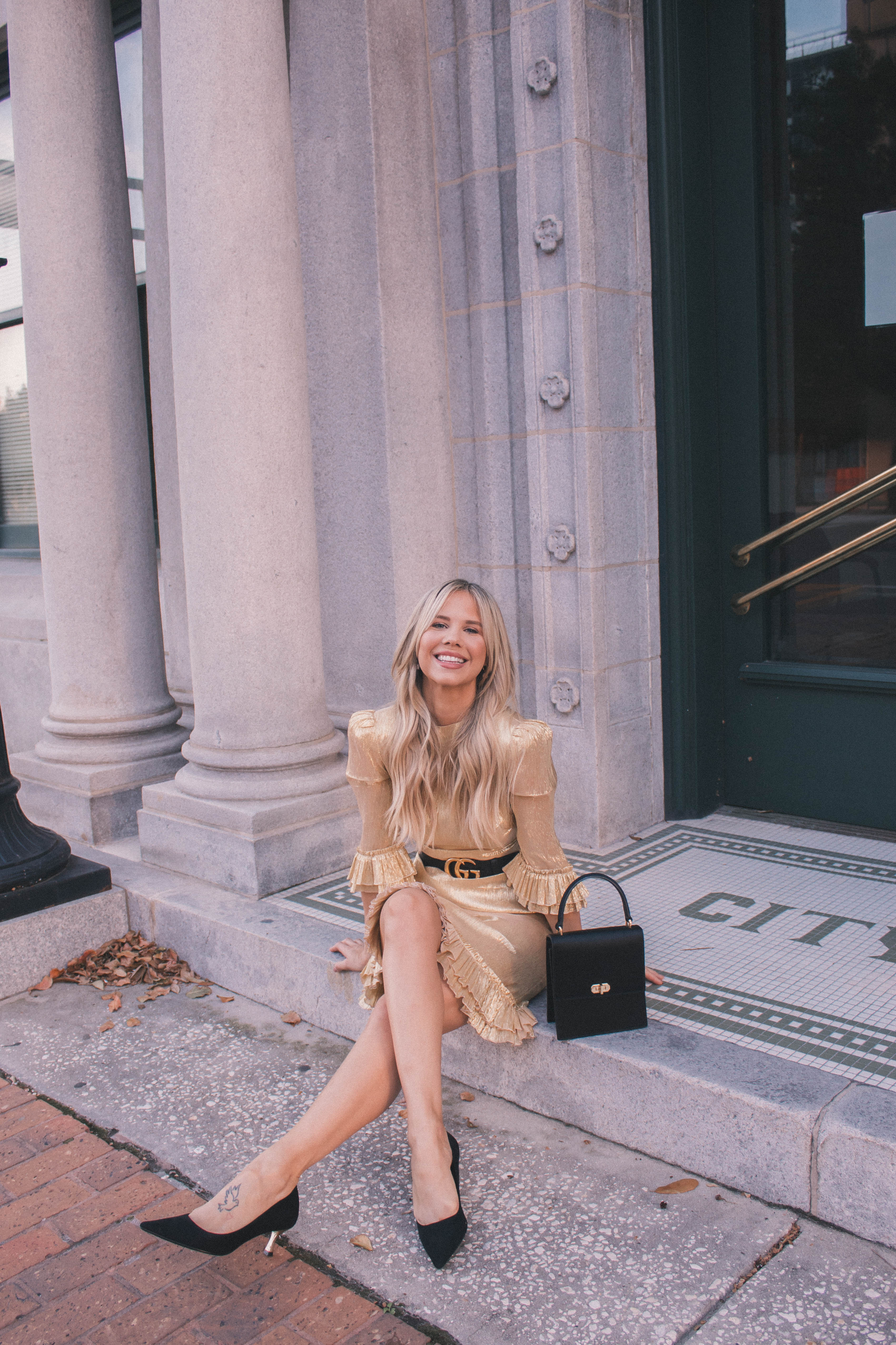A Gold dress to wear as a holiday party outfit is perfect to make you stand out this season